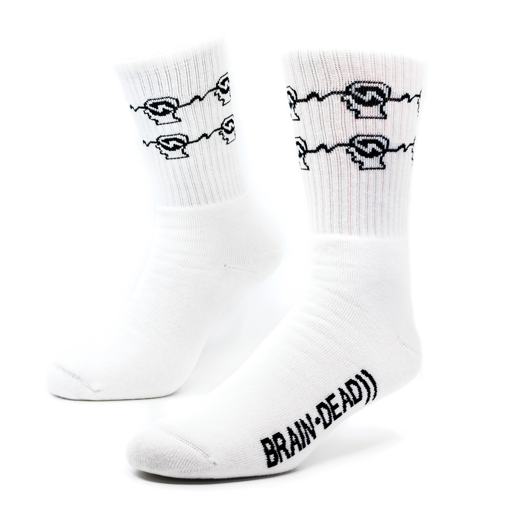 a pair of white socks with back designs on the ribbing for Brain-Dead