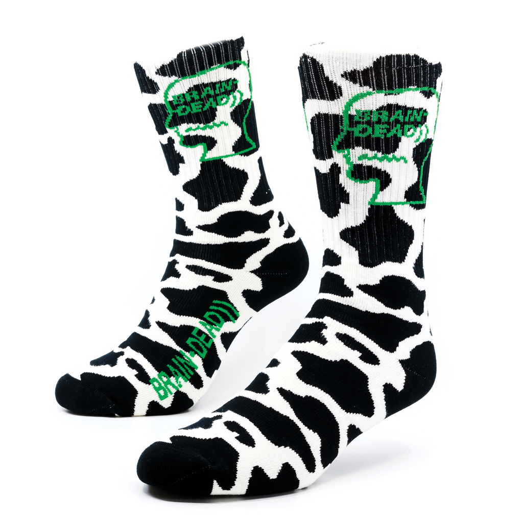 a pair of cow printed socks for Brain-Dead