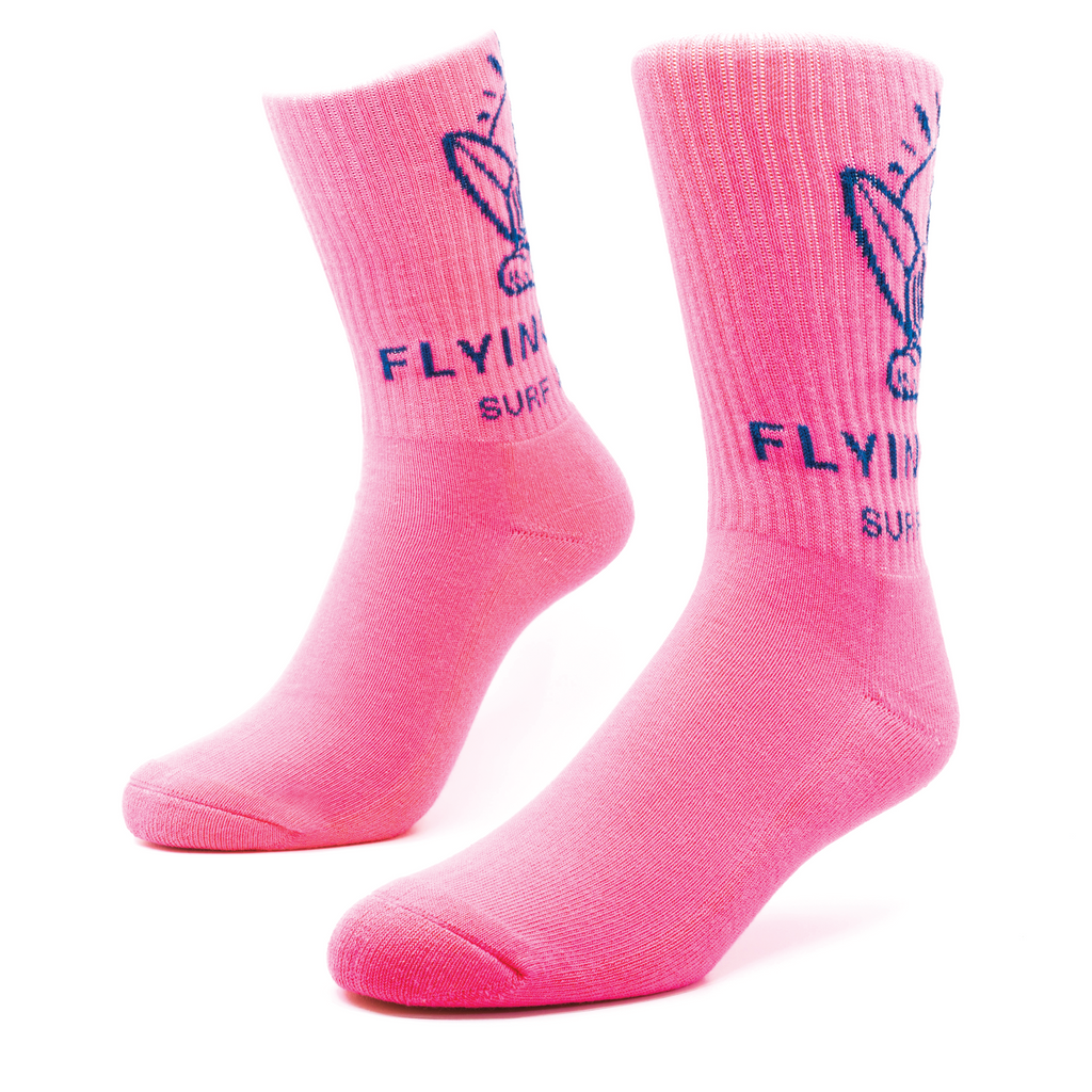Light pink socks with a cartoon socks knitting into the ribbing 