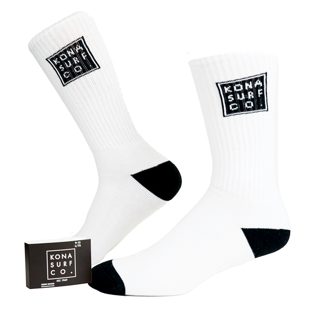 A pair of white socks with a black heel and toe for Kona Surf Co