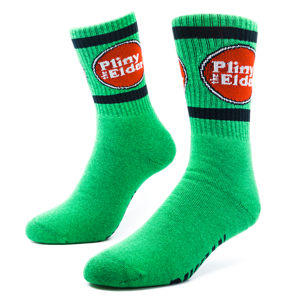 A green pair of socks that says Pliny the Elder on the ribbing