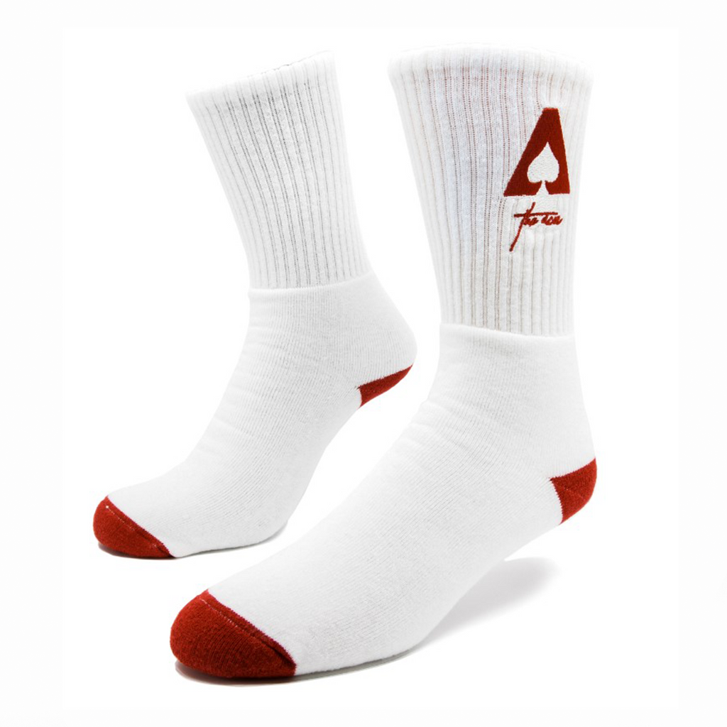 a pair of custom white socks with red features including an embroidered red logo