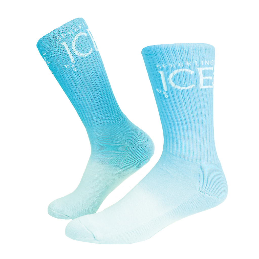 A pair of dip-dyed blue socks with the text "Sparkling Ice" knitting into it