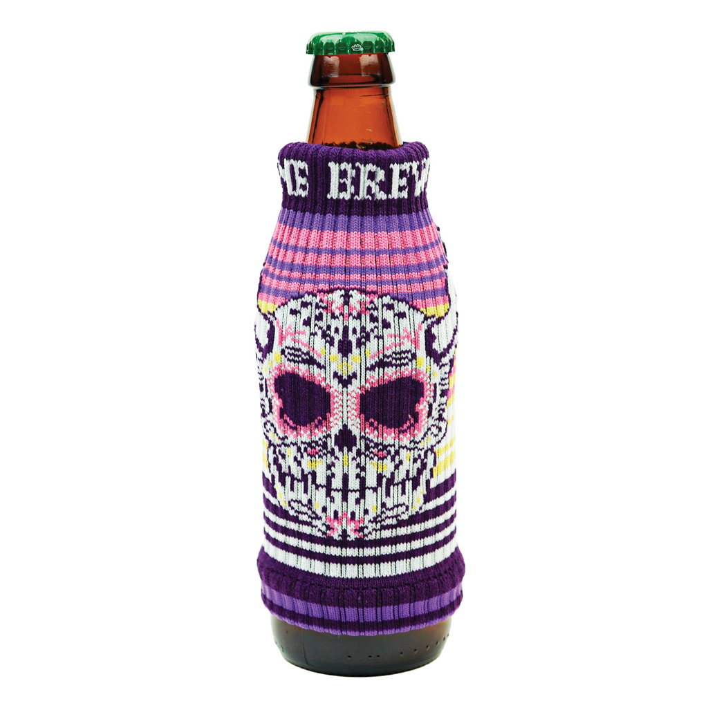 a custom knitted drink sleeve around a beer bottle