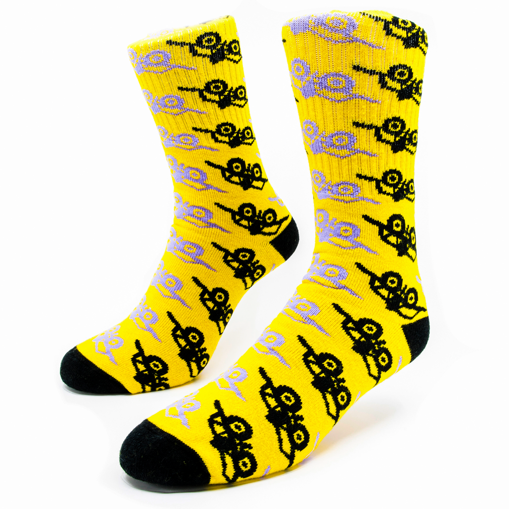 A pair of yellow socks with a pattern knitting across the body of the sock